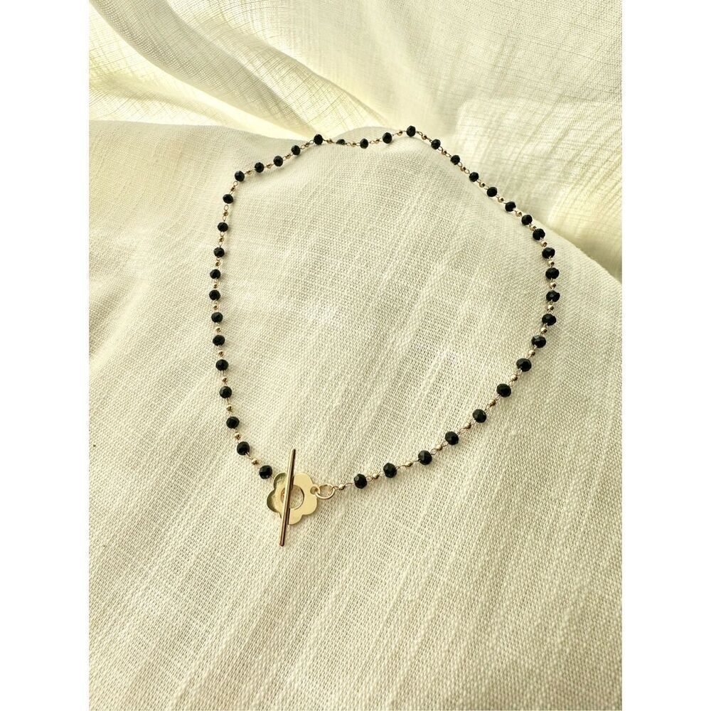Black bead and gold chain toggle necklace